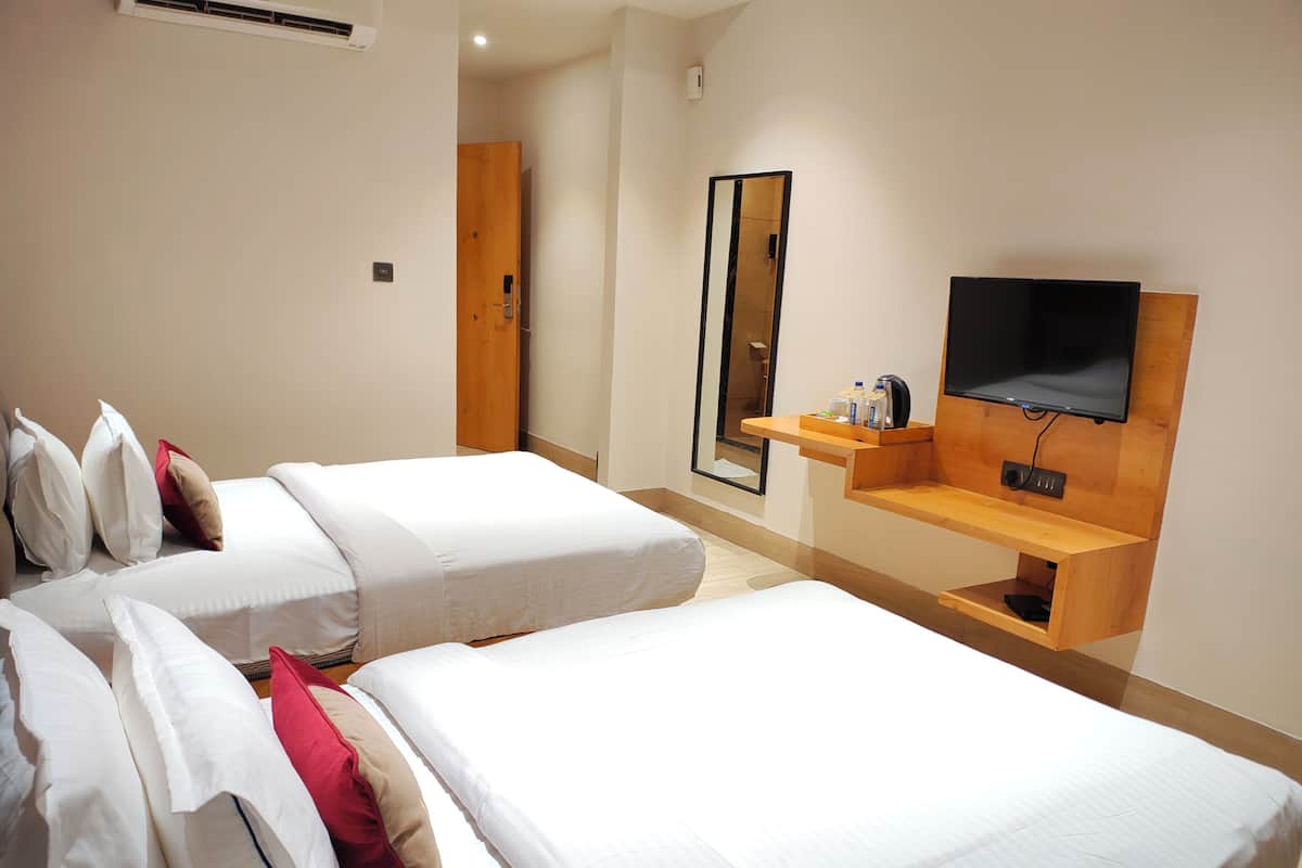 Deluxe Room, 2 Twin Beds | Desk, laptop workspace, blackout drapes, iron/ironing board
