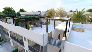 Een terras op het dak met buitenmeubilair, een jacuzzi en een pergola begroeid met groen.