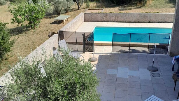 A backyard with a swimming pool, outdoor furniture, and a view of the surrounding landscape. - Country house for rent in 7700 St-Marcel d'Ardèche (Saint-Marcel-d'Ardèche)
