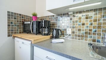 Fridge, microwave, stovetop, coffee/tea maker