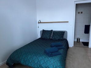1 bedroom, desk, iron/ironing board, travel crib