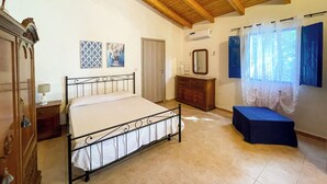 A bedroom with a bed, dresser, and a bench. - [Casa dolce sole]  Holiday Home in Sciacca - Comfort and Relax Near the Sea! (SCIACCA)