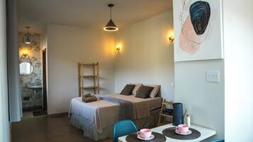 Cozy retreat with a compact bed, table, and ladder, perfect for a relaxing stay.