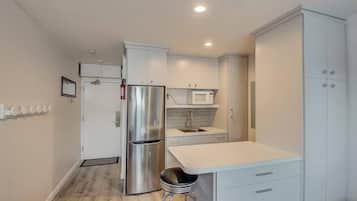 Luxury Condo | Private kitchenette | Full-sized fridge, microwave, cookware/dishes/utensils