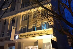A hotel with a sign reading 'Empress Inn Hotel' and a visible entrance. - Empress Dalat Hotel (Dalat)
