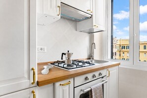 Oven, stovetop, high chair, cookware/dishes/utensils