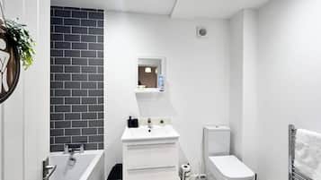 Separate bathtub and shower, deep-soaking bathtub, towels