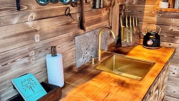 Deluxe Cottage, 1 Queen Bed, Sauna, Lake View | Private kitchen | Fridge, spices, freezer, dining tables