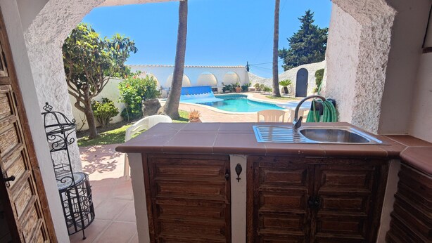 A kitchen with a view of a pool and a beach. - AP406 - VILLA JAZMIN BELLAVISTA (Nerja)