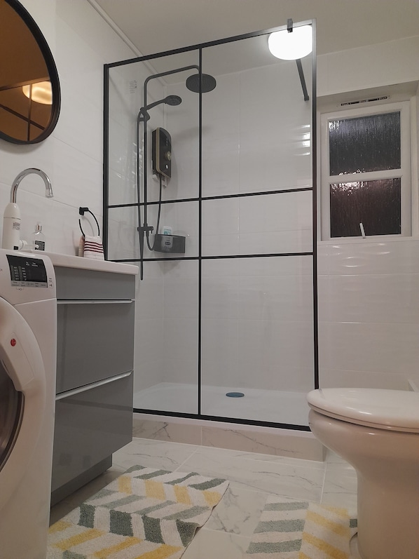 Shower, hair dryer, towels, soap