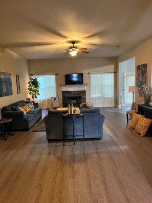 Smart TV, fireplace, books, printers