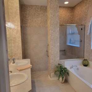 Shower, hair dryer, towels, toilet paper