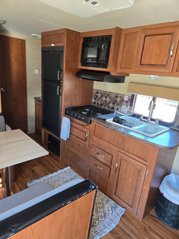 Fridge, microwave, stovetop, coffee/tea maker