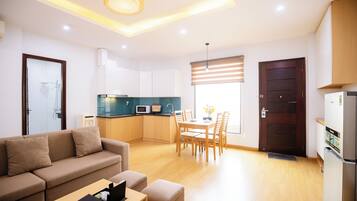 Family Apartment, Balcony, City View | Living area | TV