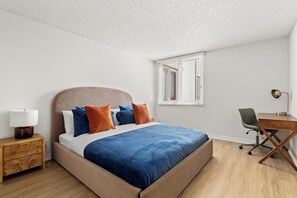 1 bedroom, desk, iron/ironing board, travel crib