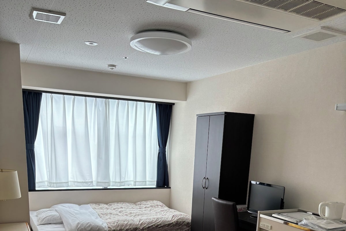 Basic Single Room, Hill View | Desk, laptop workspace, bed sheets
