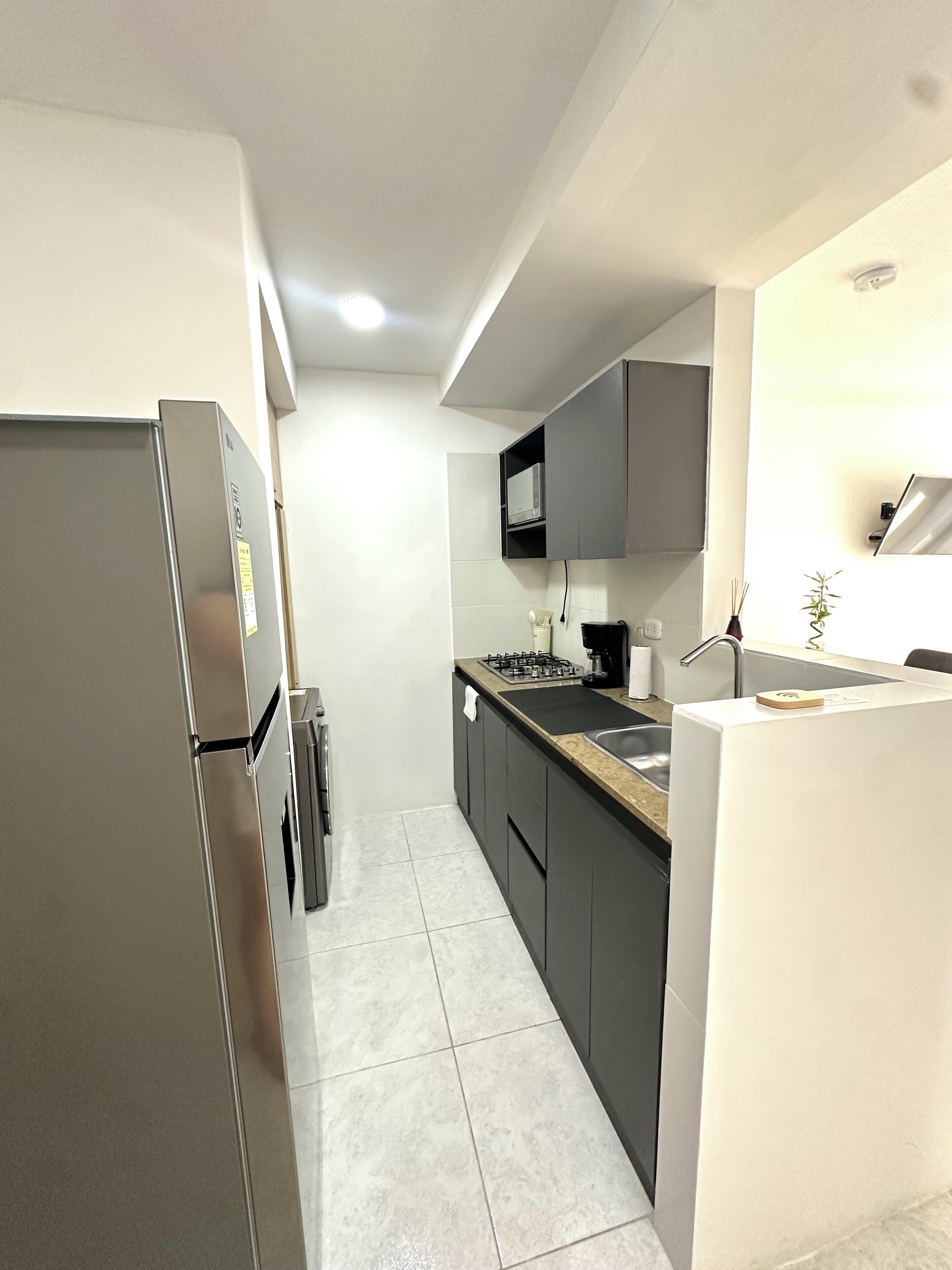 Fridge, microwave, stovetop, coffee/tea maker