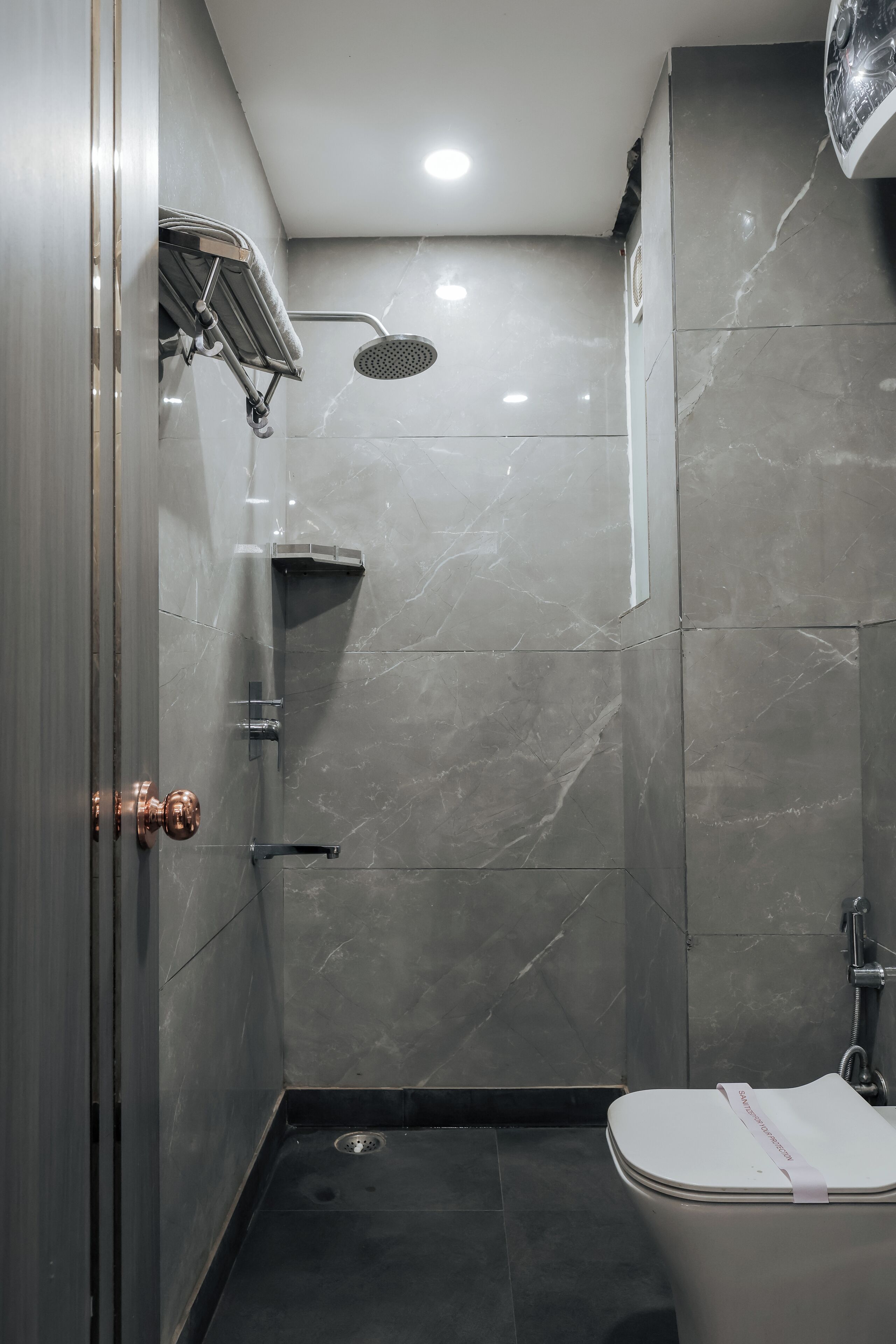 Shower, towels, soap, toilet paper