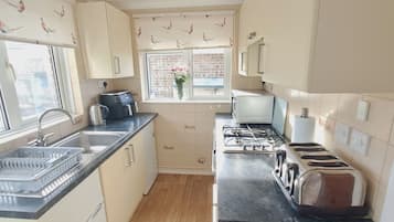 Fridge, oven, electric kettle, toaster