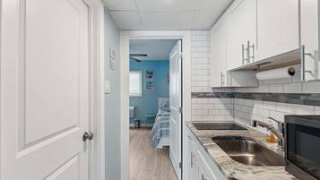 Fridge, microwave, stovetop, coffee/tea maker