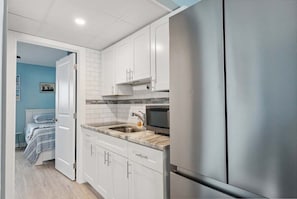 Fridge, microwave, stovetop, coffee/tea maker