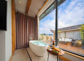 Senior Double Room | Living area | 55-inch LCD TV with cable channels