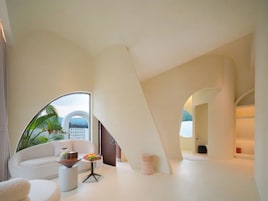 Luxury Studio Suite | Living area | 55-inch LCD TV with cable channels