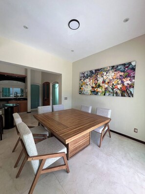 Enjoy meals in this stylish dining area with a large table and six comfortable chairs.