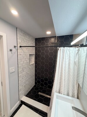 Shower, hair dryer, towels, soap