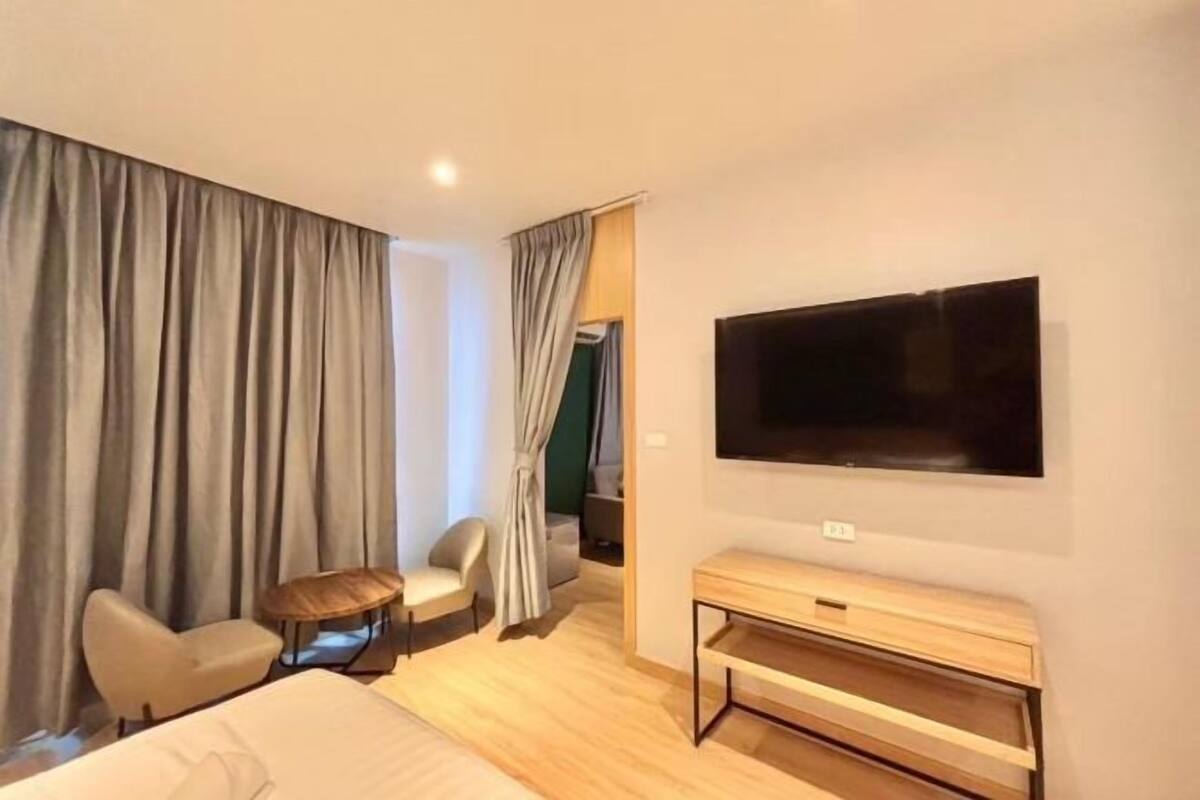Desk, laptop workspace, blackout curtains, free WiFi