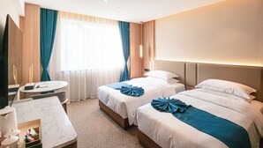 A hotel room with two beds, a round table, a TV, and a window with curtains. - shuaifubosongfandian (Wuhan)