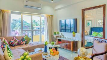 Deluxe Apartment, 2 Bedrooms, Balcony, Pool View | Living area | Flat-screen TV