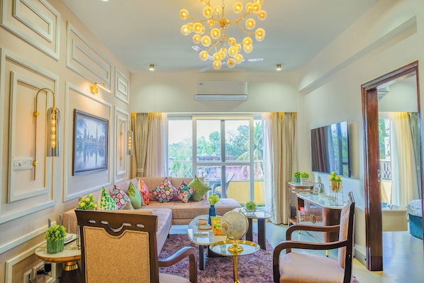 Deluxe Apartment, 2 Bedrooms, Balcony, Pool View | Living area | Flat-screen TV
