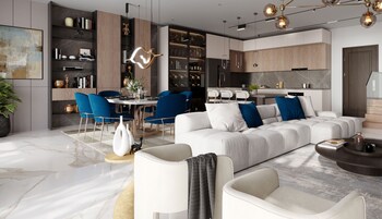 Een moderne woonkamer met een witte bank, blauwe stoelen en een eethoek met een ronde tafel.