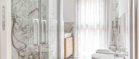 One-Bedroom Apartment with Sofa Bed | Bathroom | Shower, eco-friendly toiletries, hair dryer, towels