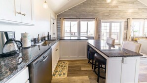 A spacious kitchen with a central island, white cabinetry, and a wooden ceiling. - Ocean "Front" Lux, 3 Living Rooms: SeaView House (Crescent city)