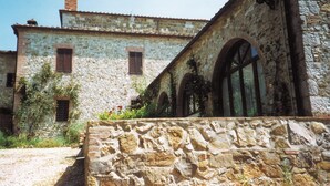 A stone building with arched windows and a bell tower. - Tuopina Chianti House [AC- Free Parking] (Topina)