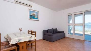 Apartment (One Bedroom Apartment with Terrace an) | Living room | 32-inch flat-screen TV with cable channels