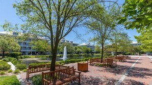 A courtyard with benches, a fountain, and a pond. - Sunset Island-Fountain Drive 39-3F-Bayside 67th St, Free WiFi, Pool, Elev, W/D, AC (Ocean City)