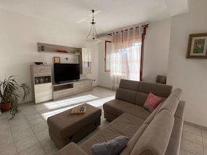 Apartment, 2 Bedrooms, Balcony, City View | Living room - Comfortable Apartment in Porto Torres (Porto Torres)