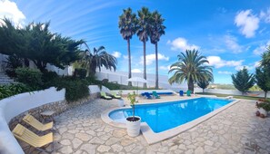 Seasonal outdoor pool, open 10:00 AM to 9:00 PM, pool umbrellas