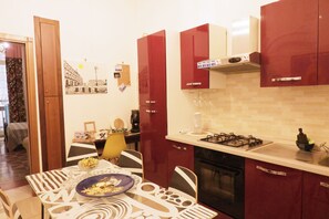 Chambre Quadruple | Cuisine privée