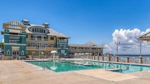 A resort with a large pool, multiple balconies, and a clear view of the ocean. - Sunset Island - 39 Fountain Drive West 3f 3 Bedroom Condo (Ocean City)