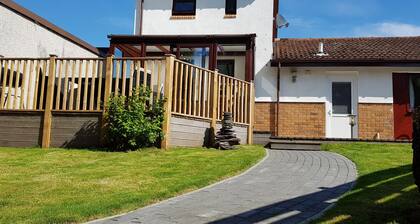 Three bedroom pet friendly detached property with conservatory and large lit decking area.