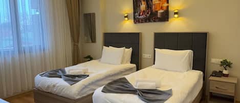 Basic Twin Room, City View | In-room safe, desk, laptop workspace, soundproofing