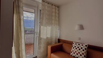 Relax on the balcony through the sliding glass door, or unwind on the sofa with a good book.