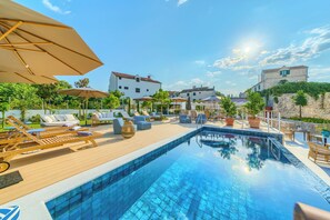 Seasonal outdoor pool, pool umbrellas, pool loungers