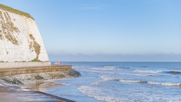 A coastal scene with a white cliff, a concrete sea wall, and a calm sea. - Seas the Day, Broadstairs (Broadstairs)