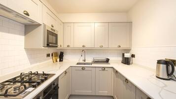 Family Apartment, City View | Private kitchen | Espresso maker, coffee/tea maker, electric kettle