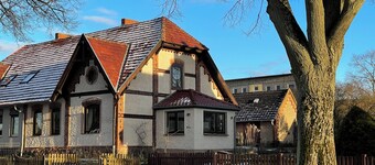 Historic house under lime trees with natural garden. Family-friendly.